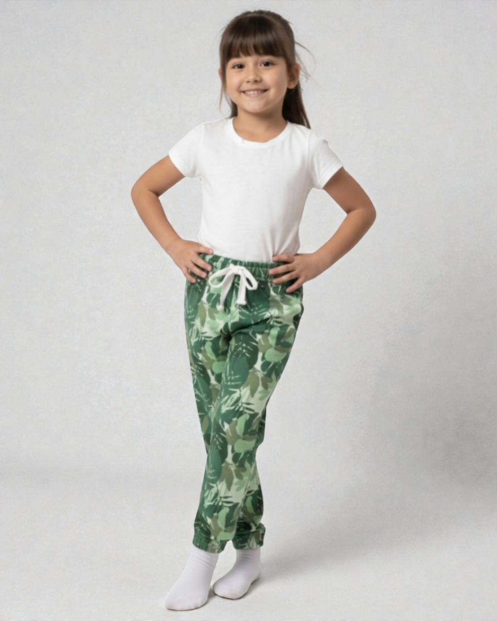 Girl front view wearing pure cotton green camouflage print pyjama kids sleepwear FNS India.