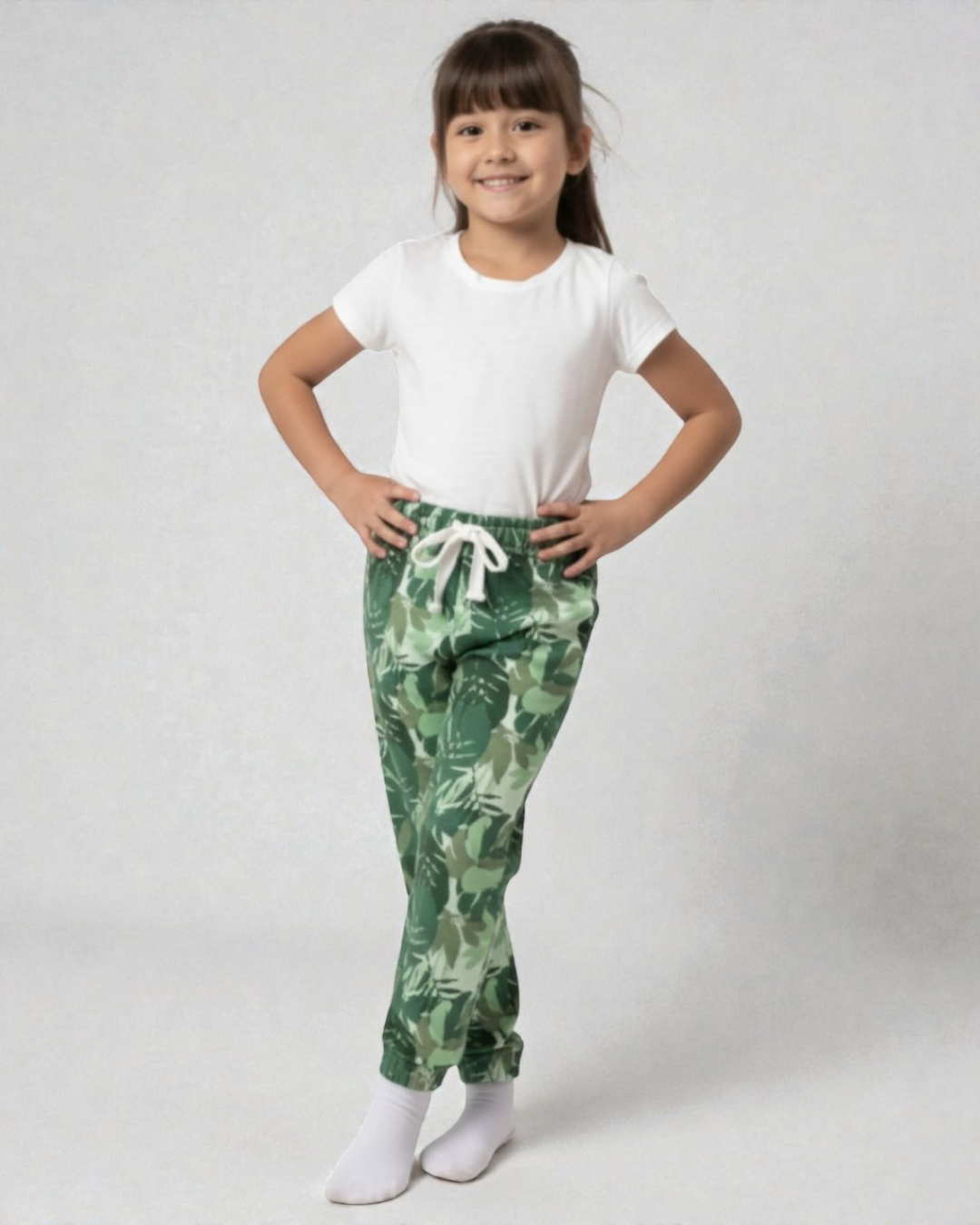 Girl front view wearing pure cotton green camouflage print pyjama kids sleepwear FNS India.