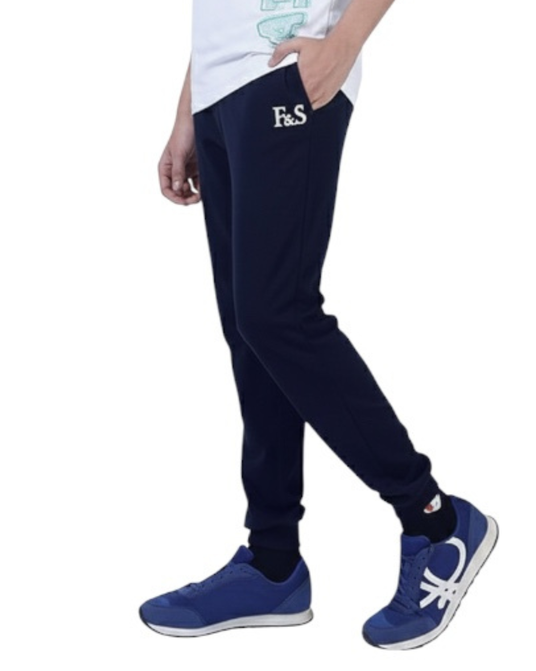 Person wearing navy jogger pants with 'F&F' branding and blue sneakers on a white background