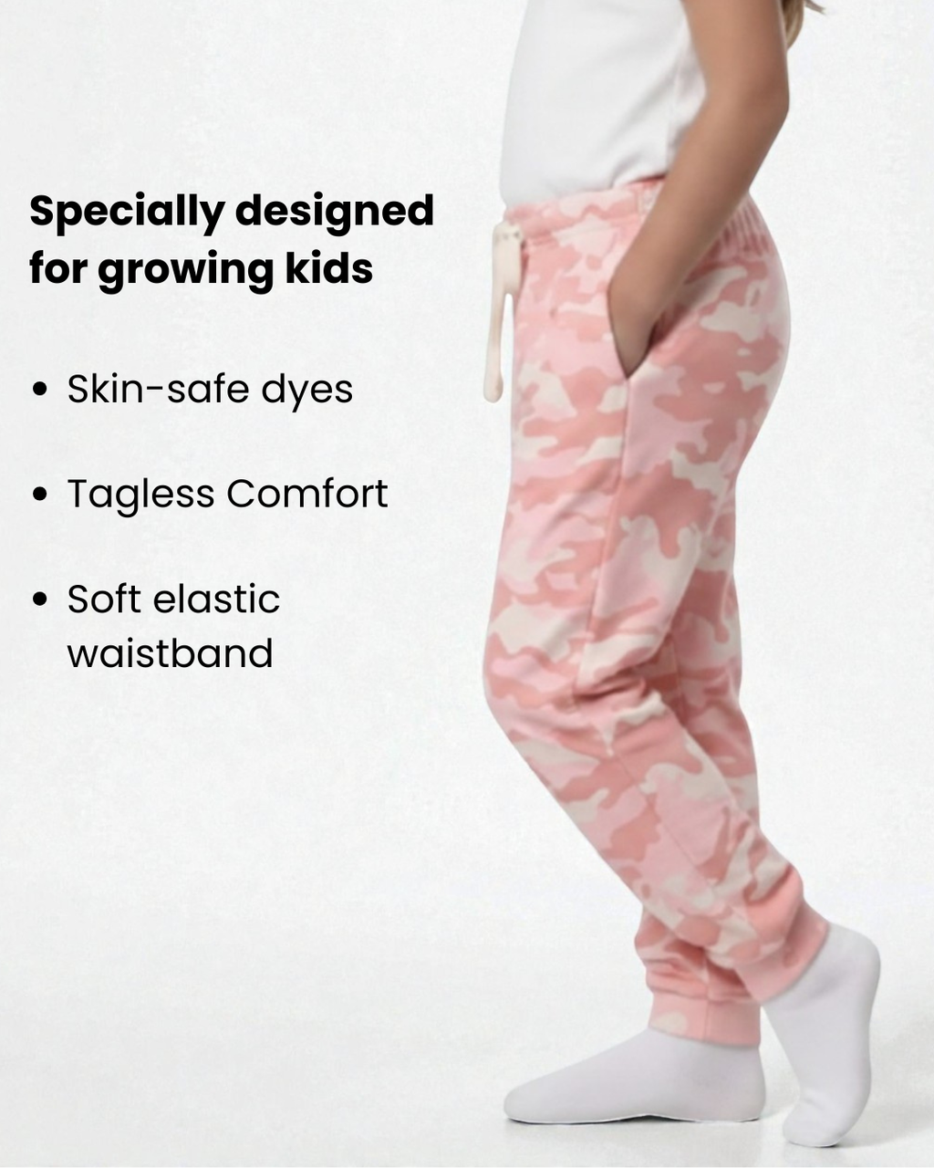 Girl side view wearing pure cotton pink camouflage print pyjama kids sleepwear FNS India with text about product features.