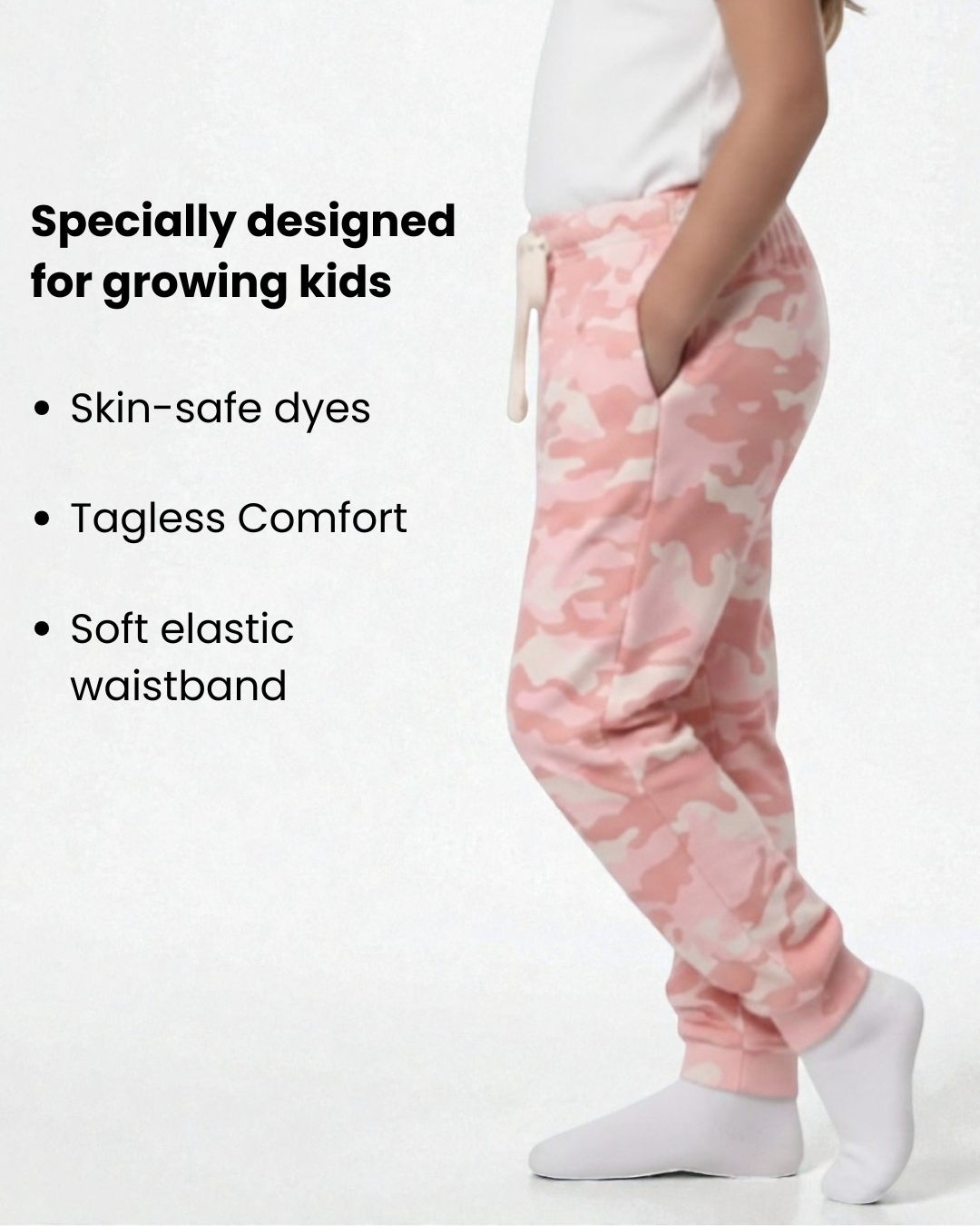 Girl side view wearing pure cotton pink camouflage print pyjama kids sleepwear FNS India with text about product features.