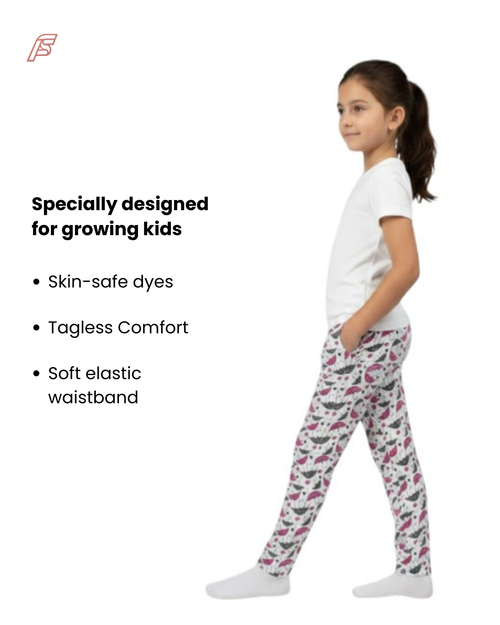 Girl side view wearing pure cotton umbrella print pyjama kids loungewear FNS India with text about product features on a white background.