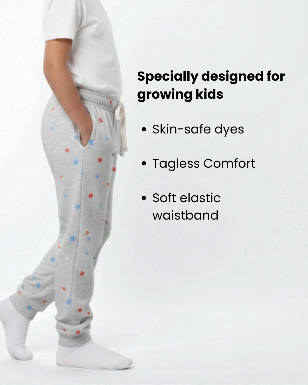 Girl side view wearing pure cotton grey stars print pyjama kids sleepwear FNS India with text about product features.