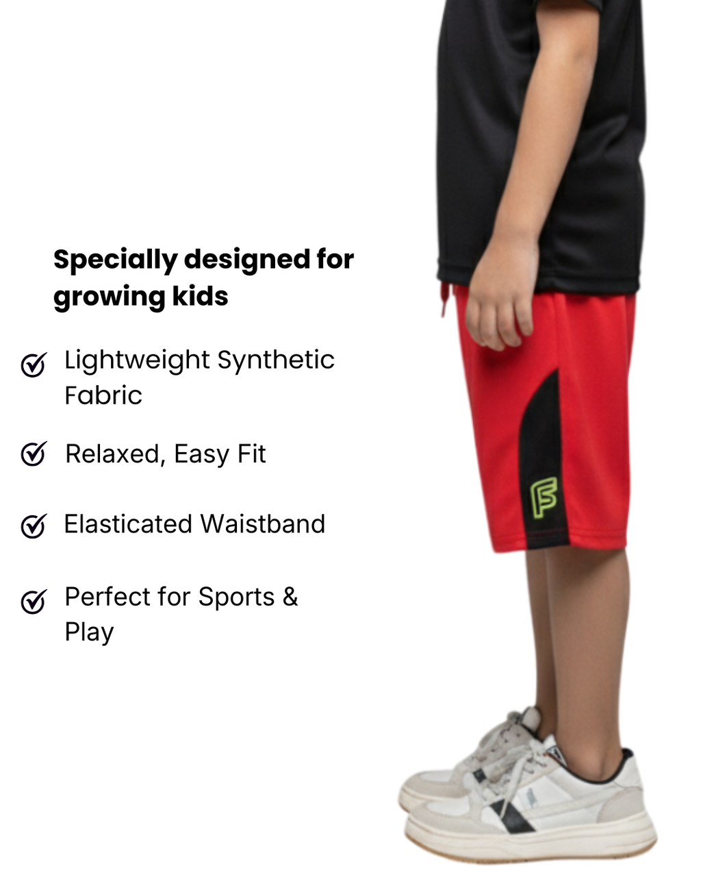 Boy's  wearing red shorts with black accents, standing against a white background with text about the shorts' features.