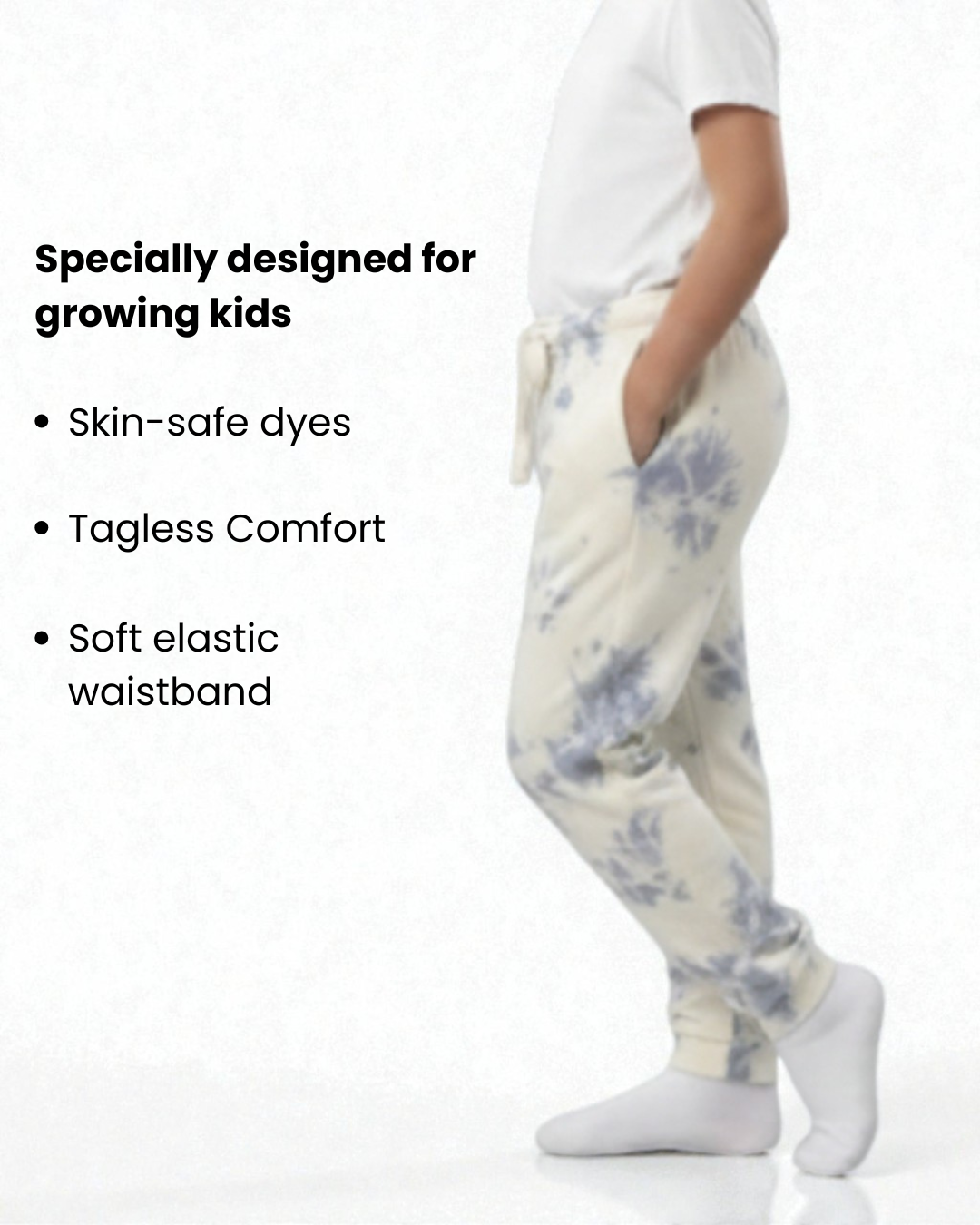 Girl side view wearing pure cotton white and blue tie-dye pyjama kids sleepwear FNS India with text highlighting features on a white background.