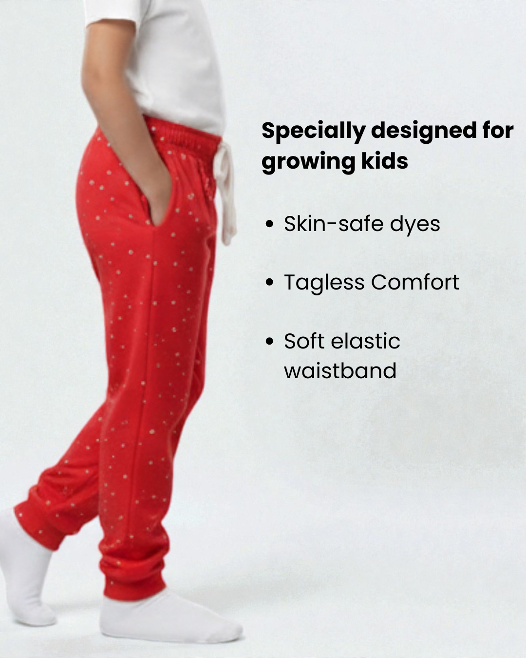 Side view red polka print girls pyjama with text about product features ages 8 to 18 FNS India.
