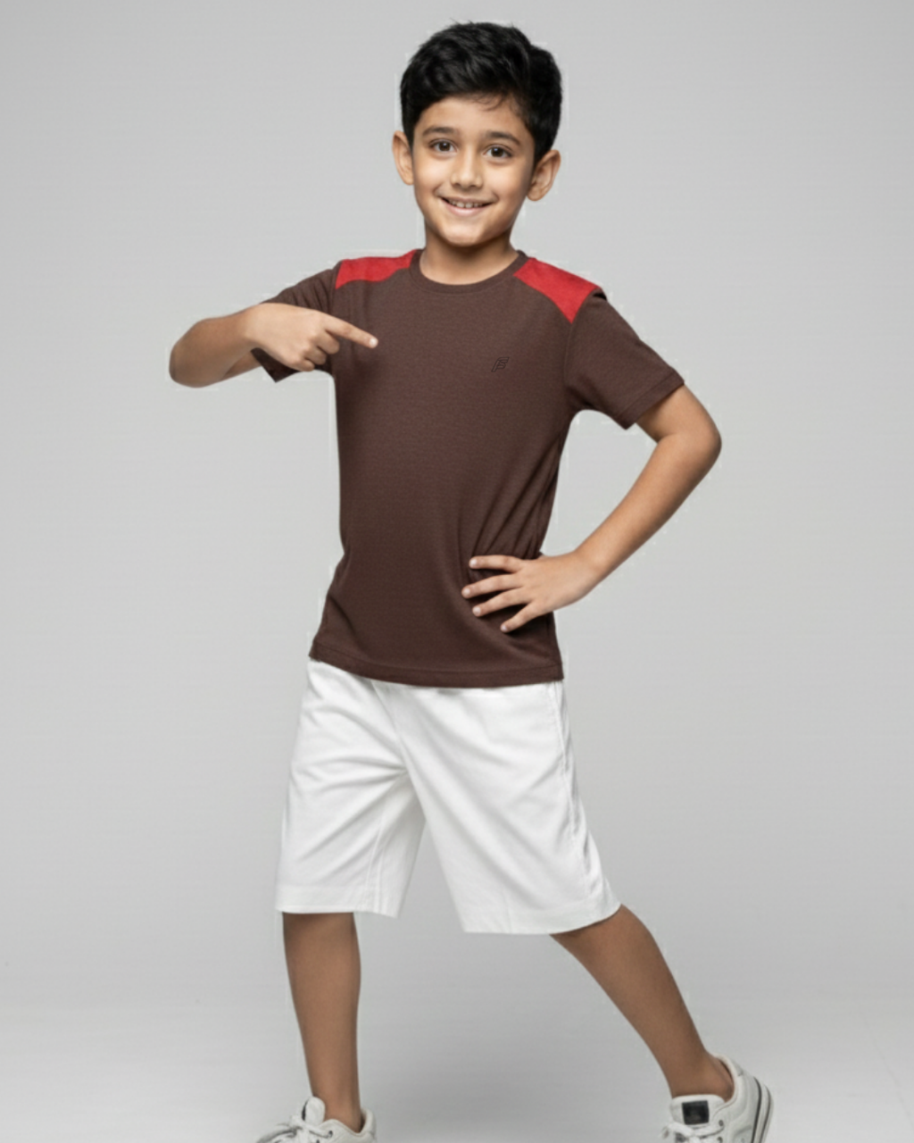 Boy's wearing a brown and red shirt  on a gray background