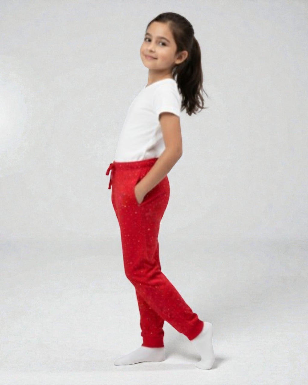 Girl wearing red polka print pyjama ages 8 to 18 FNS India.

