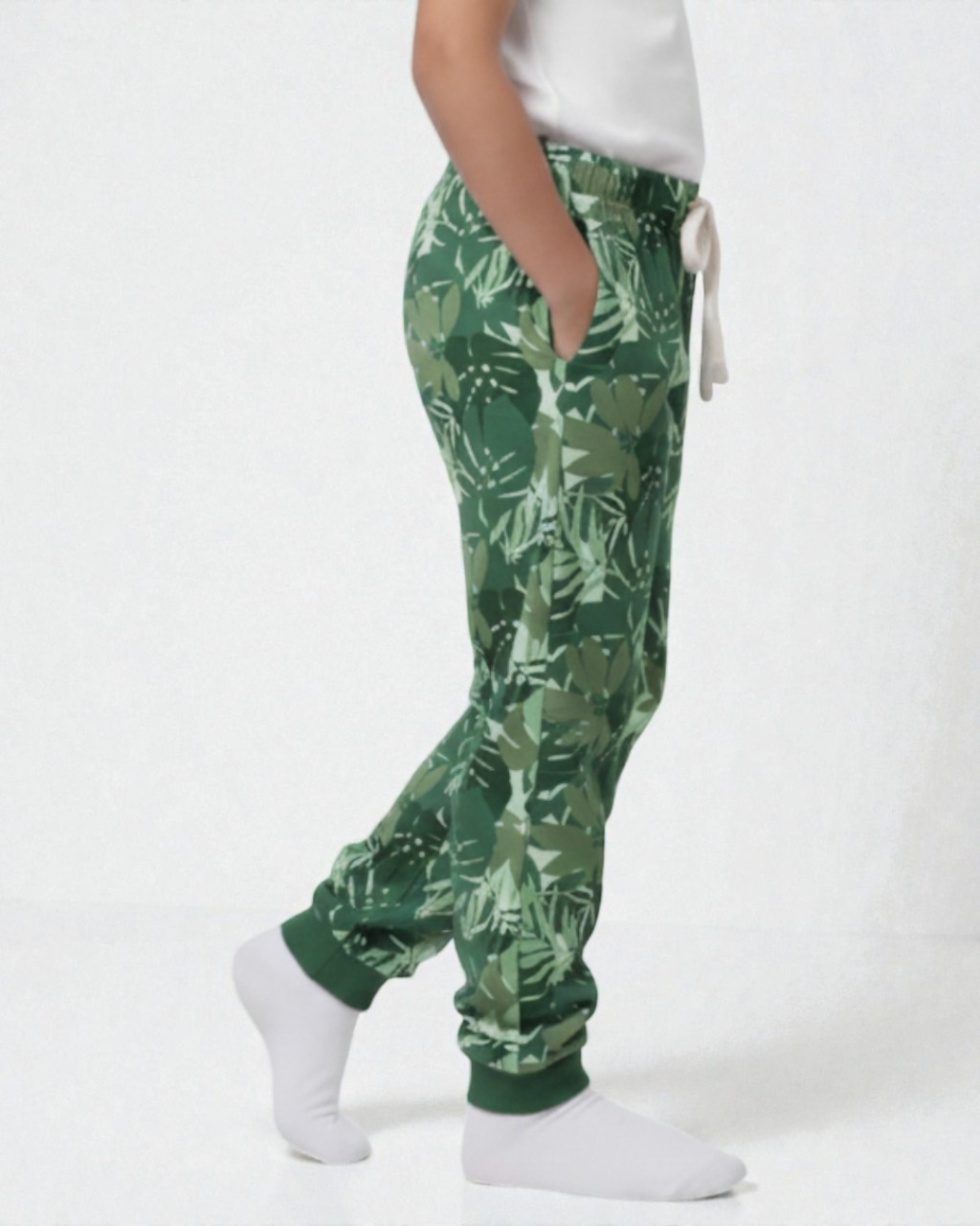Girl side view wearing pure cotton green camouflage print pyjama kids sleepwear FNS India.
