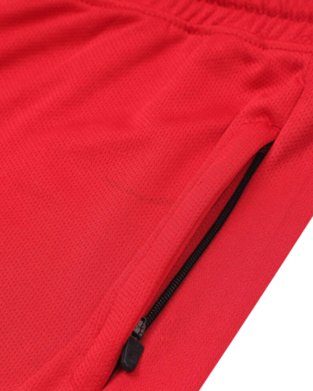 Close-up of a red jacket with a black zipper on a white background