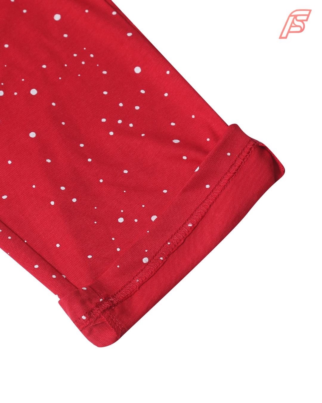 Red fabric with white polka dots on a white background